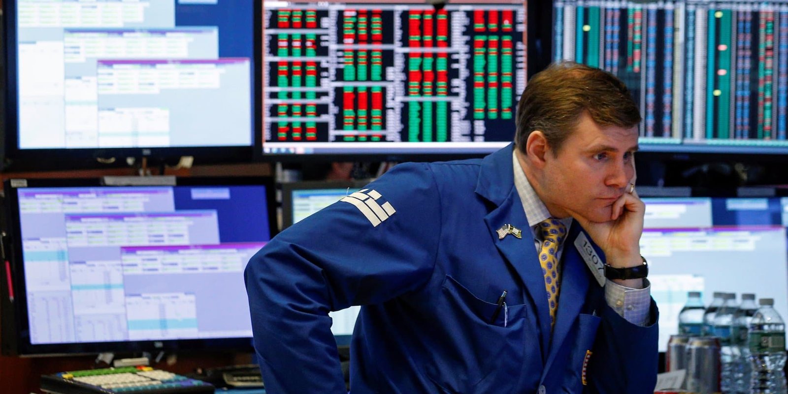 trader at stock market looking at scree